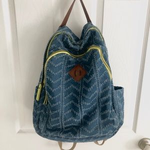 Denim backpack with faux leather and neon accents